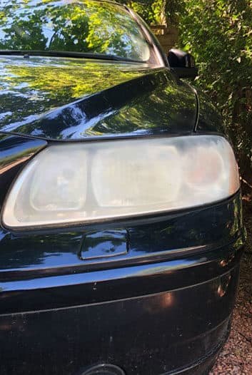 Headlight before and after restoration — before